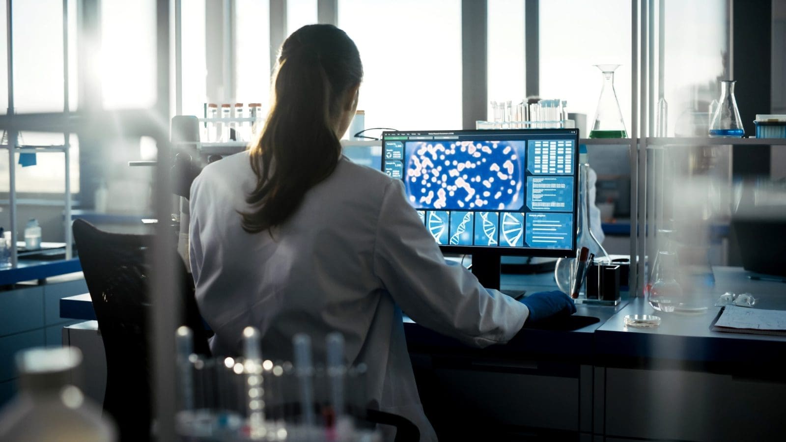 female researcher working at computer