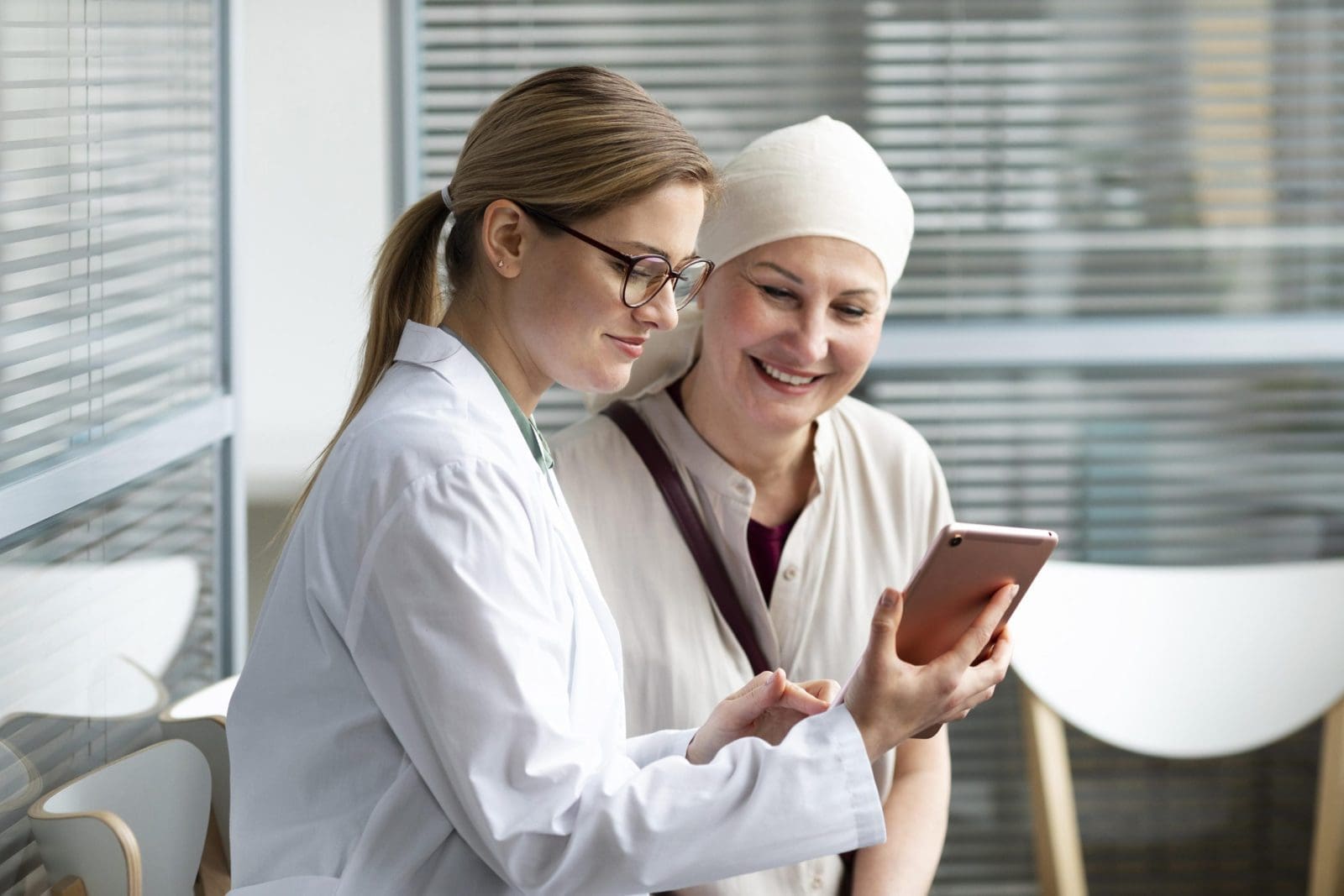 Middle-aged woman with skin cancer talking to her doctor